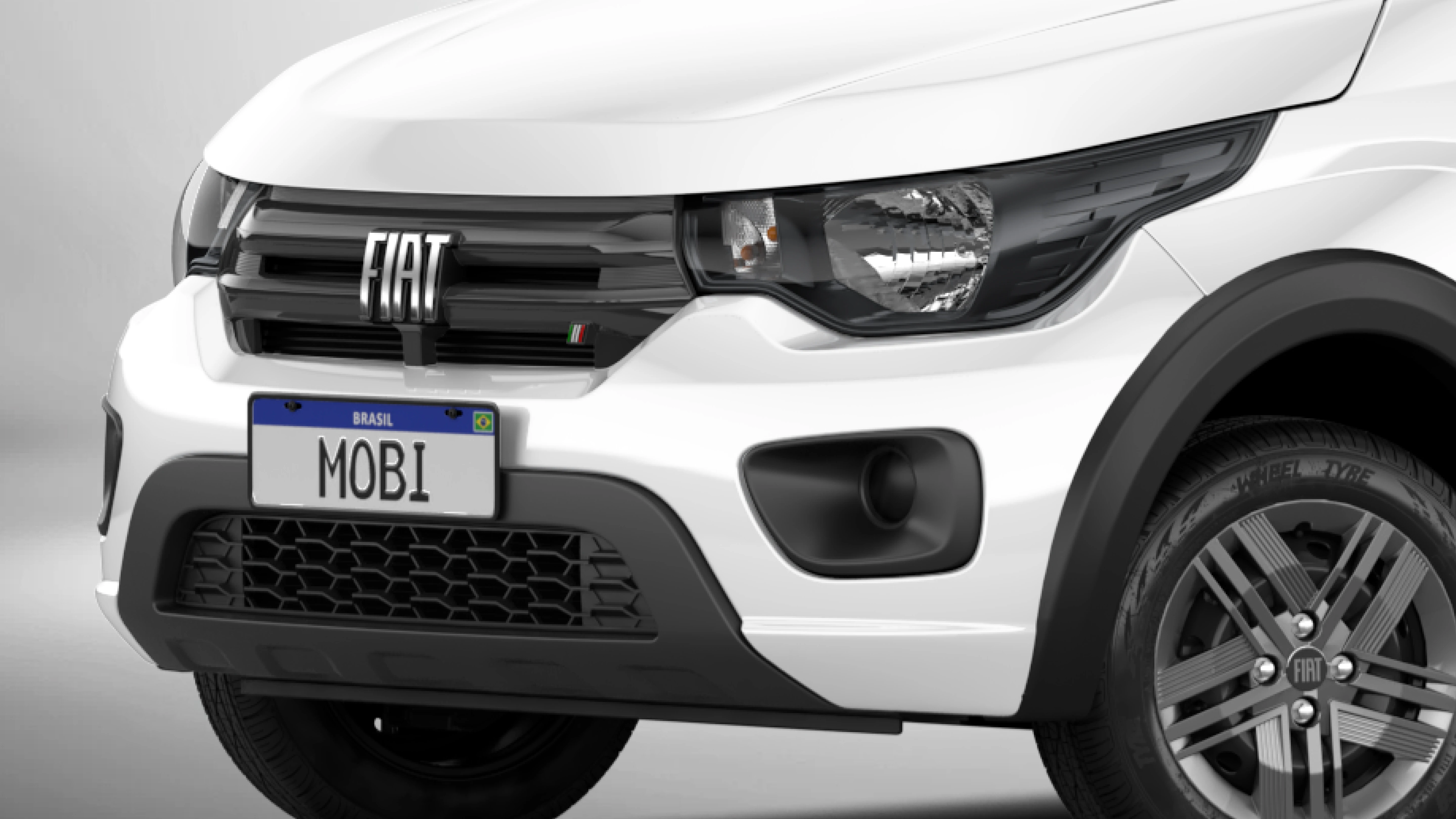 Dianteira de Fiat Mobi na cor vermelha, com destaque para faróis com máscara negra.