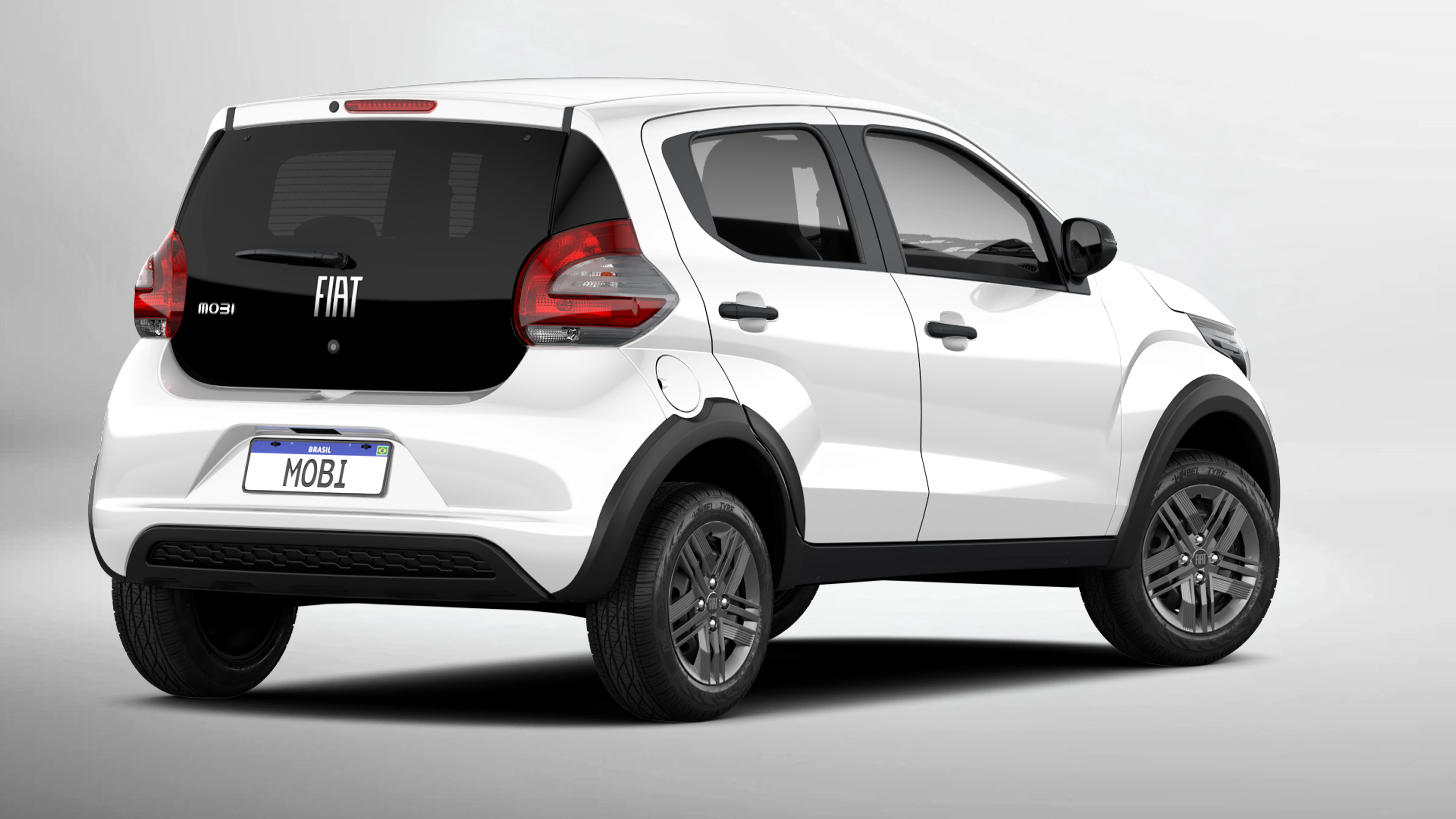 Visão lateral e traseira do Fiat Mobi na cor vermelha, com destaque para tamanho compacto, ideal para os grandes centros urbanos.
