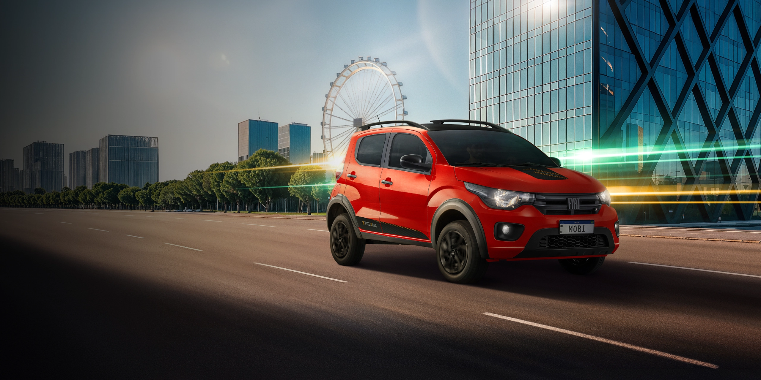 Fiat Mobi versãoTrekking na cor vermelha, em pista asfaltada com cenário majoritariamente urbano ao fundo.
